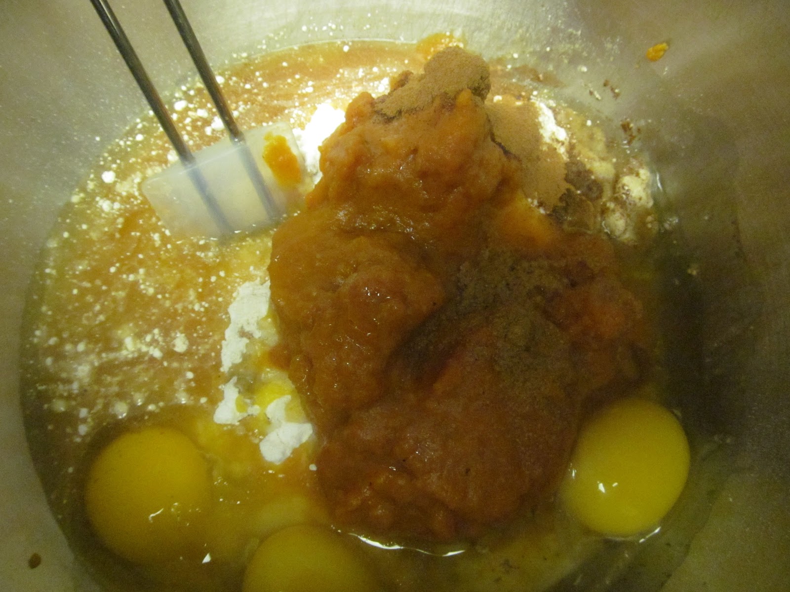 Beat cake mix, pudding mix, pumpkin, oil, water, eggs, cinnamon, and ginger on low for 1 minute