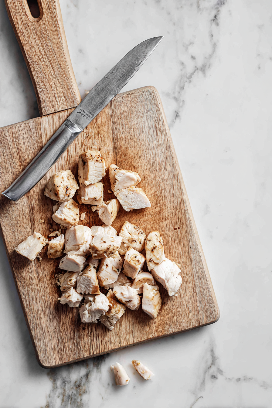 Once cool, dice the chicken, and set aside. Heat your pan with the veggie oil over medium heat.