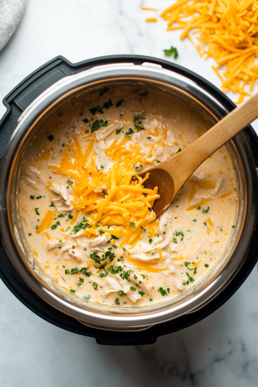 Stirring the Cream Sauce and Adding Cheese