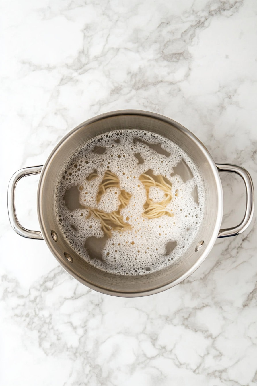 Cook the spaghetti in salted water until al dente. Drain and set aside.