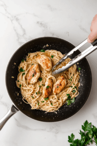 Toss in the cooked pasta and chopped parsley. Mix well to combine.