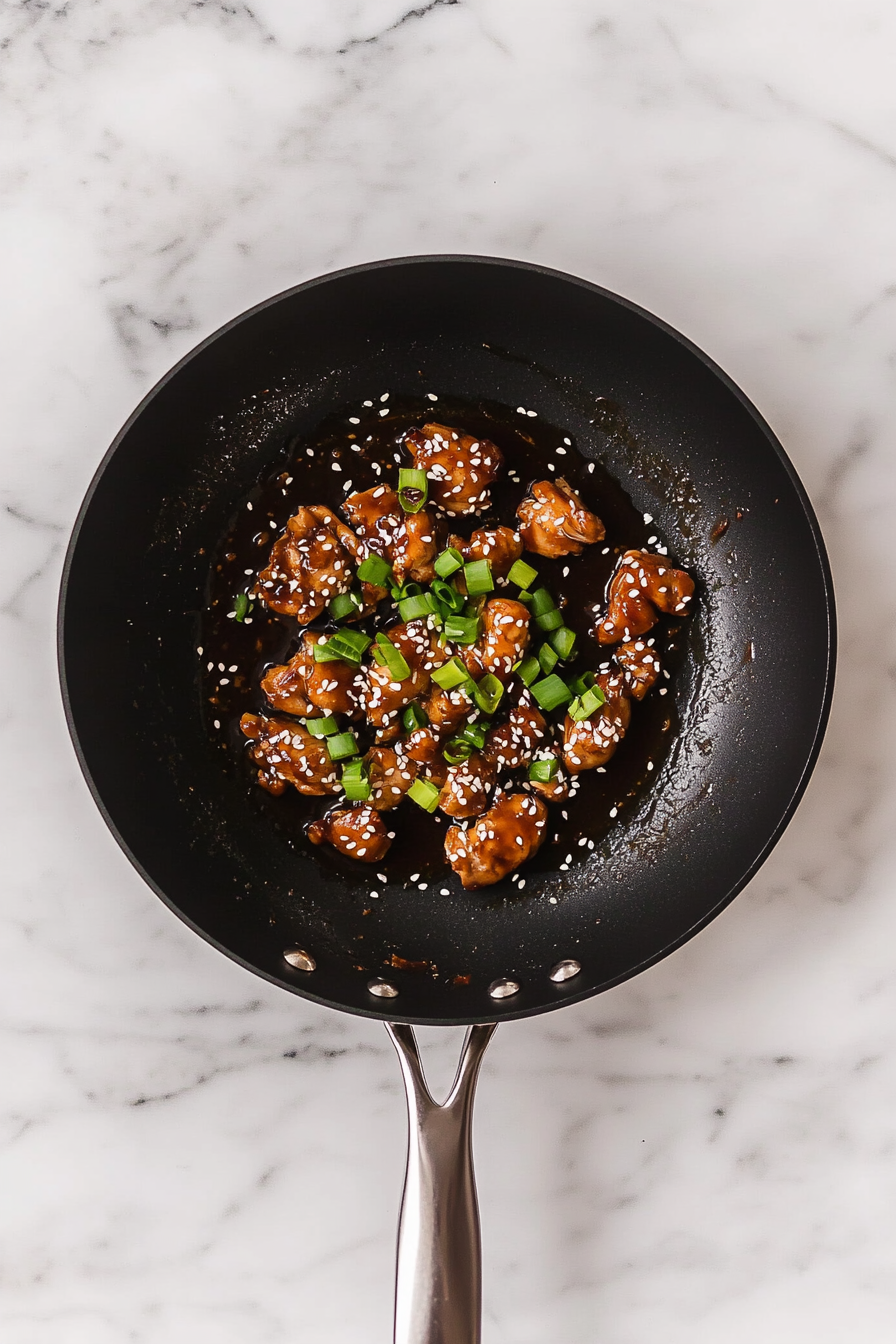 Garnish with sliced green onions and sesame seeds if desired. Serve hot.