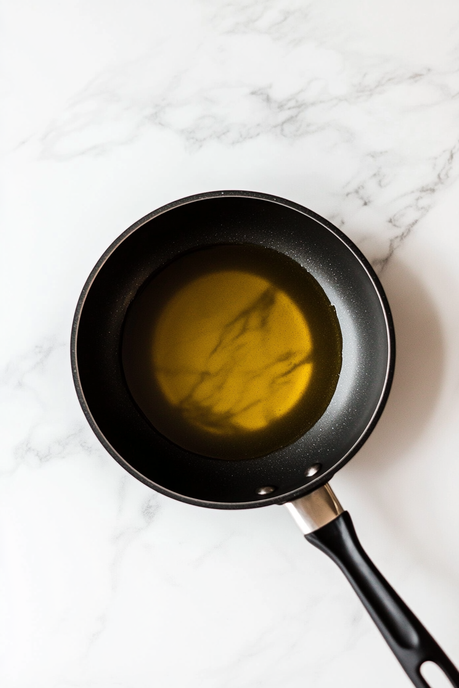 Heat canola oil in a deep fryer or deep pan to 350°F (175°C).