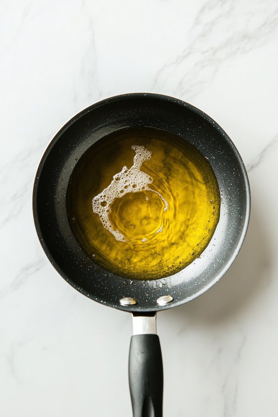 Heat the oil: In a deep fryer or heavy skillet, heat oil to 350°F (175°C).