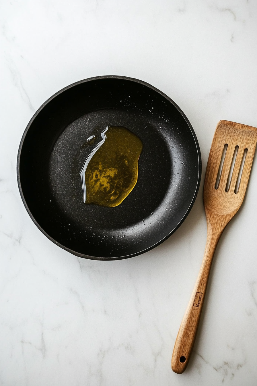 Heat olive oil in a large skillet over medium heat.