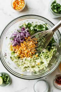 In a separate bowl, toss all slaw ingredients together.
