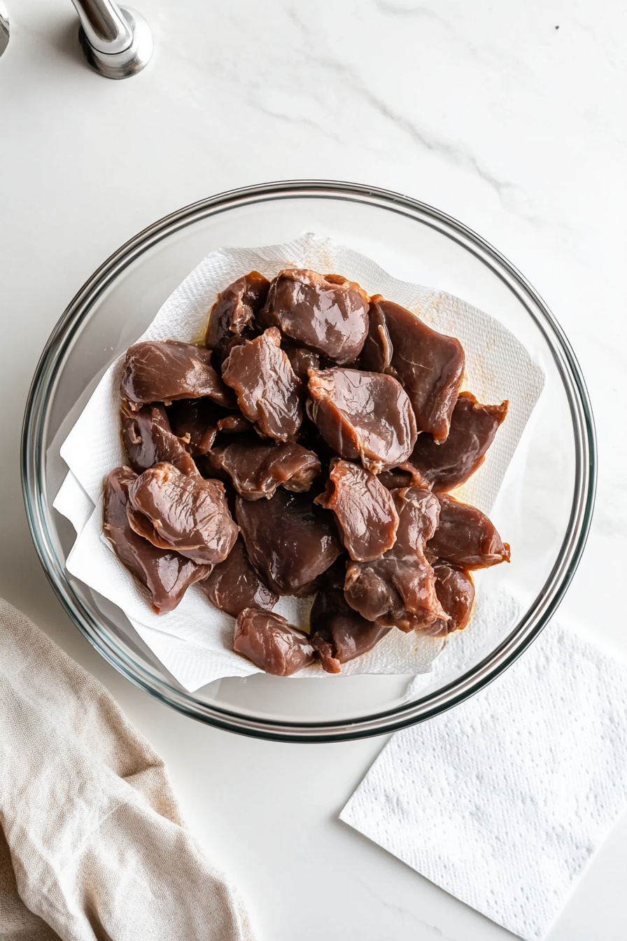 Rinse and pat dry the chicken livers thoroughly.