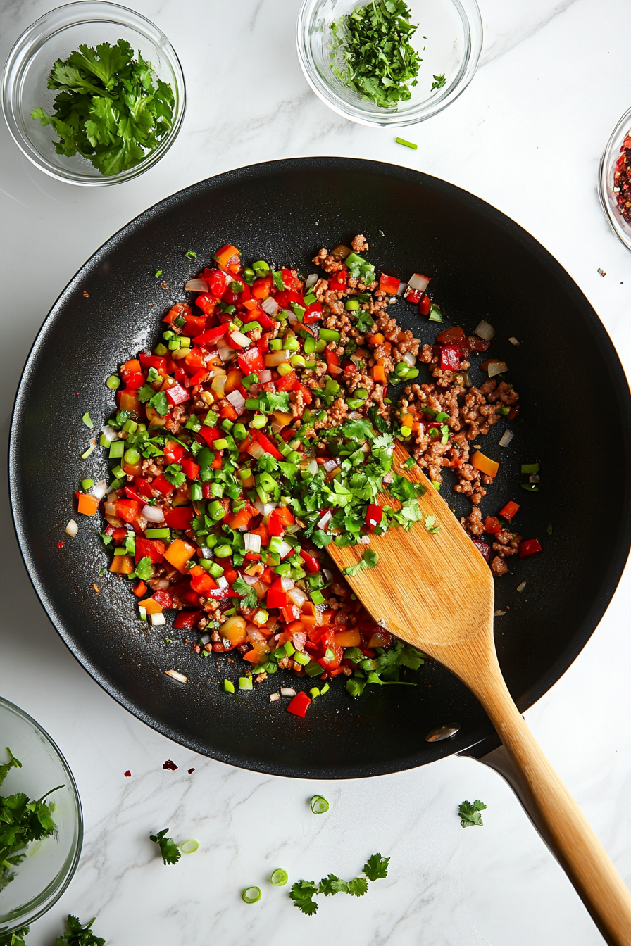 Stir in chopped green onion tops and fresh parsley or cilantro.