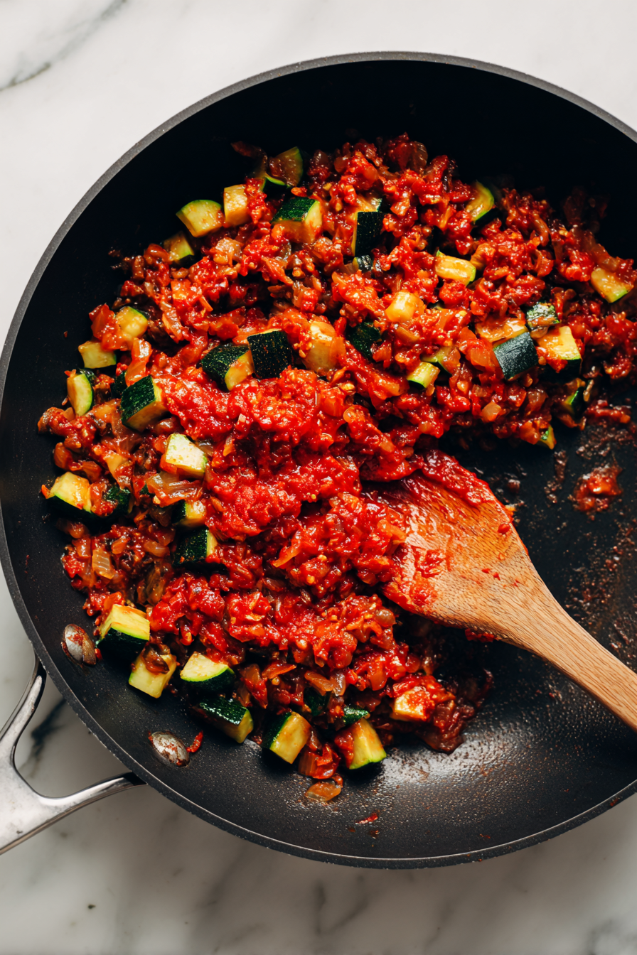 Add tomato paste and stir until fragrant.