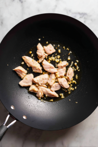 Add sliced chicken and cook until no longer pink.