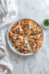 Buffalo Chicken Flatbread Recipe in 20 Minutes! Garnish with green onions, slice, and serve hot.