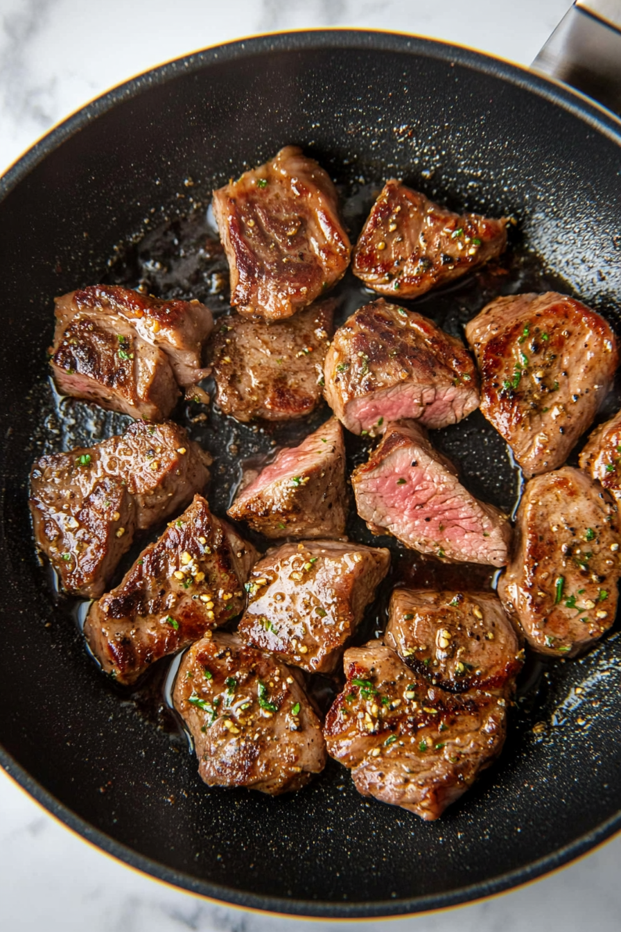 Cook lamb: Add oil to the pan and stir fry marinated lamb on high heat until cooked through and slightly caramelized.