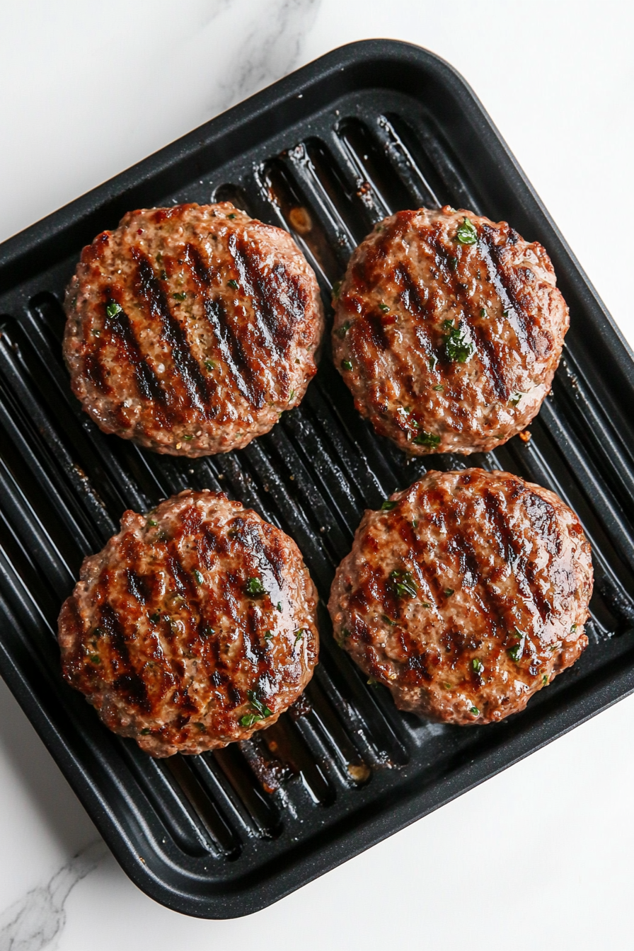 Heat a grill pan over medium heat and cook patties for 5-6 minutes per side, or until done.