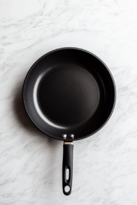 Heat oil: In a large skillet or wok, heat vegetable oil over medium-high heat.
