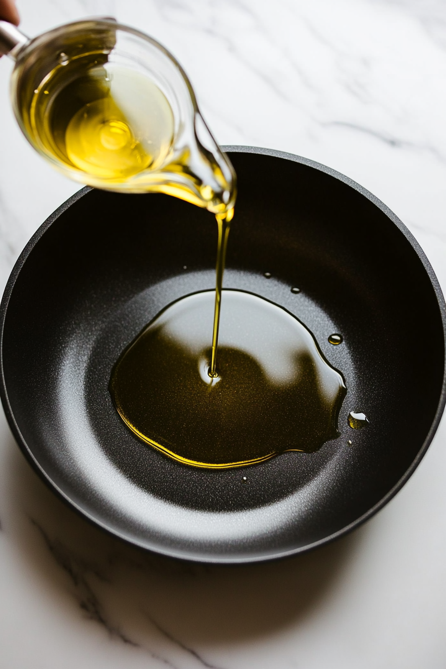 Heat a skillet over medium-high heat and add a little olive oil if needed.