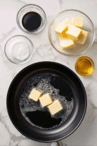 Heat oil and butter in a skillet over medium heat.