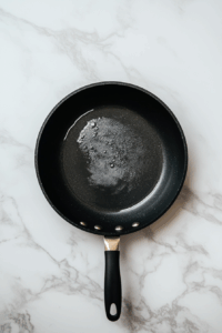 Heat oil in a frying pan over medium heat until hot but not smoking.