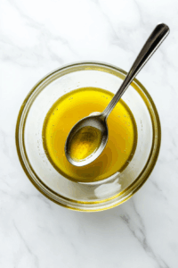 In another bowl, stir together Dijon mustard, olive oil, and honey until smooth.