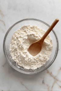 In a bowl, mix flour, salt, cumin seeds, and ghee. Add warm water gradually to form a slightly firm dough. Rest it for 15 minutes.