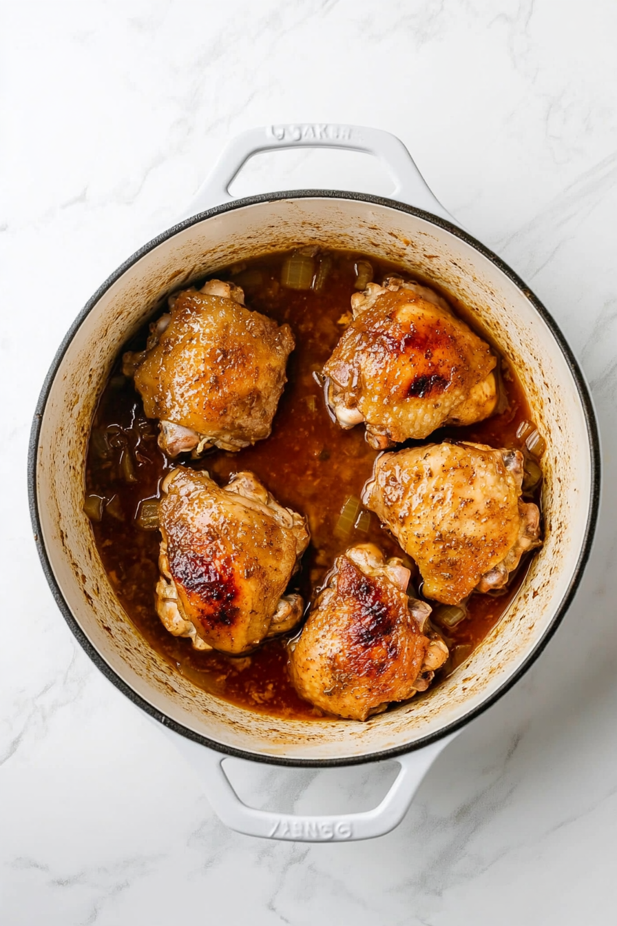 Remove the lid and simmer uncovered for 5–10 minutes to thicken the sauce.