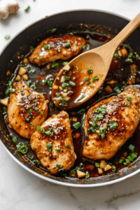 Toss to coat the chicken evenly in the sticky glaze.