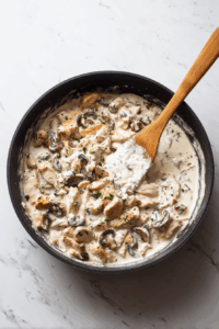Lower heat, stir in sour cream gently.