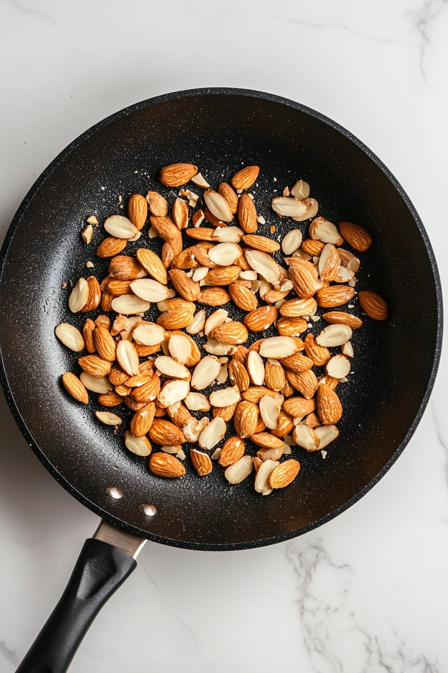 Toast sliced almonds in a dry skillet until golden.