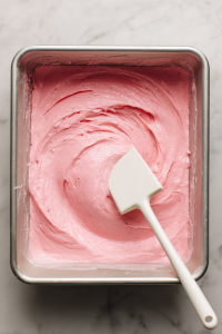 Stir in strawberry puree and vanilla extract until well combined. Pour the batter evenly into the prepared pan(s).