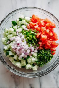 Transfer chopped veggies to a mixing bowl.