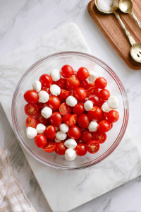 Add fresh mozzarella pearls to the bowl.
