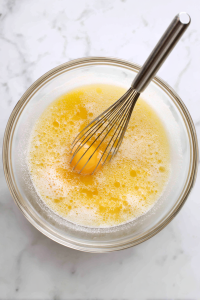 In a mixing bowl, whisk eggs and sugar until light and fluffy.