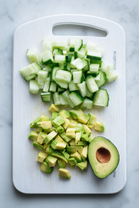 While the rice cools, dice the cucumber and avocados.
