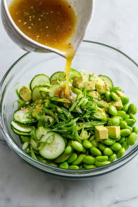 Pour in the dressing and gently toss everything together.